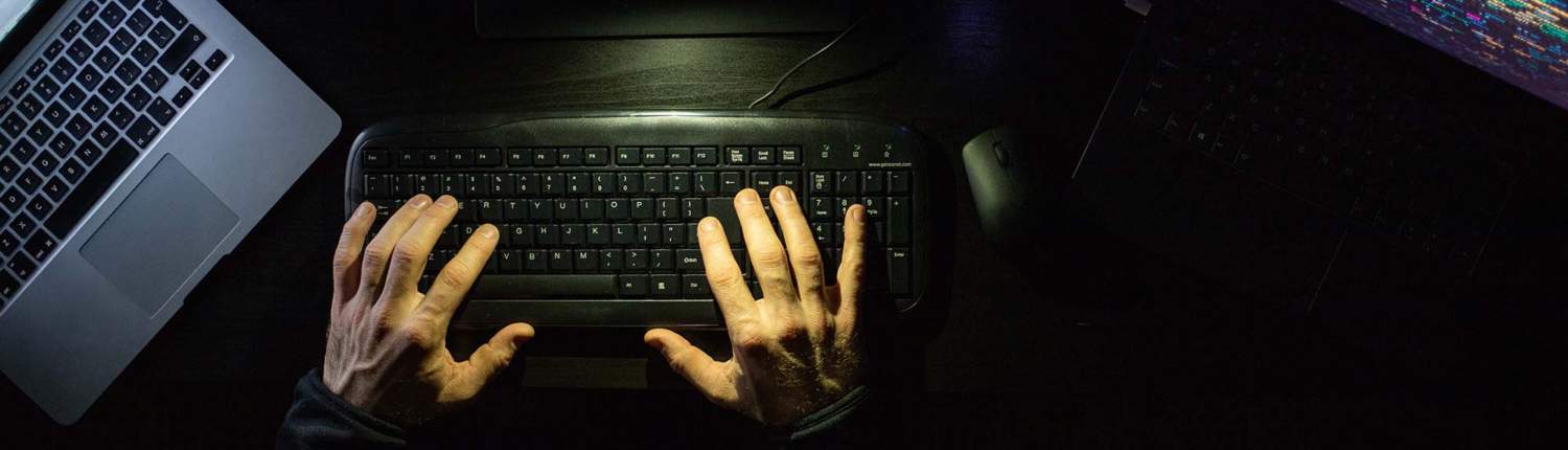 hacker coding at night cybersecurity concept